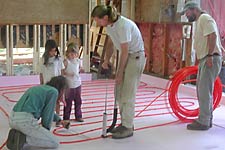 June 14 - Children supervise layout of tubing