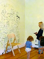 June 26 - Students decorate farmhouse wall before it's torn down